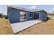 Rear exterior showing a patio area with sliding glass doors to the interior at 4555 Hannah Ln, St Petersburg, FL 33709