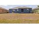 Spacious backyard with a blue home exterior at 4555 Hannah Ln, St Petersburg, FL 33709
