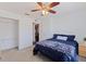 Cozy bedroom showcasing a ceiling fan and comfortable carpeting at 4555 Hannah Ln, St Petersburg, FL 33709