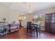Bright dining area with hardwood floors, chandelier, and plenty of natural light at 4555 Hannah Ln, St Petersburg, FL 33709