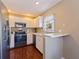 Efficient kitchen featuring stainless steel appliances and bright white cabinetry at 4555 Hannah Ln, St Petersburg, FL 33709