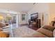 Inviting living room featuring hardwood floors, a cozy fireplace, and natural light at 4555 Hannah Ln, St Petersburg, FL 33709