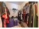 Organized walk-in closet with shelving and rods for optimal storage capacity at 4555 Hannah Ln, St Petersburg, FL 33709