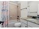 Neutral-toned bathroom featuring a bathtub, and granite countertops at 4612 W Lowell Ave, Tampa, FL 33629