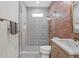 Contemporary bathroom featuring a glass shower, geometric tile, and a wood vanity with marble top at 4612 W Lowell Ave, Tampa, FL 33629