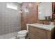 Modern bathroom featuring patterned tile, a glass shower, and a stylish vanity at 4612 W Lowell Ave, Tampa, FL 33629