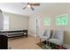 This modern bedroom features a ceiling fan, recessed lights, and two neon Minecraft themed wall decorations at 4612 W Lowell Ave, Tampa, FL 33629