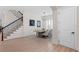 Dining room showcasing hardwood floors, modern chandelier, and an adjacent staircase at 4612 W Lowell Ave, Tampa, FL 33629
