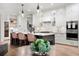 Beautiful kitchen with white cabinets, large island, modern appliances and stylish pendant lighting at 4612 W Lowell Ave, Tampa, FL 33629