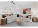 This spacious living room is adjacent to a gourmet kitchen with stylish decor and modern accents at 4612 W Lowell Ave, Tampa, FL 33629