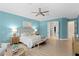 Spacious primary bedroom with serene paint, plush decor, and ensuite bathroom access at 4612 W Lowell Ave, Tampa, FL 33629