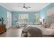 Bright main bedroom with large windows, comfortable seating, and stylish decor at 4612 W Lowell Ave, Tampa, FL 33629