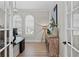 Bright office space featuring arched windows, plantation shutters, and stylish decor at 4612 W Lowell Ave, Tampa, FL 33629