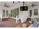Covered patio with brick floors and ceiling fans with stairs leading to an elevated yard at 4612 W Lowell Ave, Tampa, FL 33629