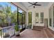 Inviting patio with screened enclosure, brick flooring and access to pool area and backyard at 4612 W Lowell Ave, Tampa, FL 33629