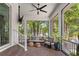 Inviting covered patio with comfortable seating and a ceiling fan offers a relaxing outdoor space at 4612 W Lowell Ave, Tampa, FL 33629