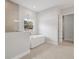 Modern bathroom featuring a soaking tub, tile floors, and a separate shower at 4630 Cedar Fog Ct Dr, Valrico, FL 33596