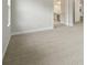 Carpeted bedroom featuring access to the en-suite bathroom and a neutral color palette at 4630 Cedar Fog Ct Dr, Valrico, FL 33596