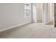 Bright bedroom features plush carpeting, a window, and a walk-in closet at 4630 Cedar Fog Ct Dr, Valrico, FL 33596
