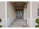 Inviting entryway with brick floor leading to elegant double front doors at 4630 Cedar Fog Ct Dr, Valrico, FL 33596