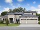 Stunning two-story home with a three-car garage, neutral stucco, and a meticulously manicured lawn at 4630 Cedar Fog Ct Dr, Valrico, FL 33596