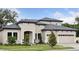 Charming home with a modern design, well-maintained lawn, and a two-car garage at 4630 Cedar Fog Ct Dr, Valrico, FL 33596
