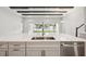 Spacious kitchen island featuring quartz countertops, stainless steel dishwasher, and open concept design at 4630 Cedar Fog Ct Dr, Valrico, FL 33596