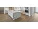 Modern kitchen with white island, countertops, cabinets and stainless steel appliances at 4630 Cedar Fog Ct Dr, Valrico, FL 33596
