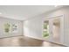 Spacious living room with hardwood floors and glass doors leading to backyard at 4630 Cedar Fog Ct Dr, Valrico, FL 33596