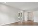 Spacious living room with hardwood floors, glass doors, and ample lighting at 4630 Cedar Fog Ct Dr, Valrico, FL 33596