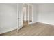 A room with light colored flooring and white trim features double glass doors at 4630 Cedar Fog Ct Dr, Valrico, FL 33596