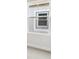 A close-up of a window in a neutral-toned room with carpeted floors at 4630 Cedar Fog Ct Dr, Valrico, FL 33596