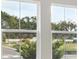 Outdoors seen through a window with views of trees and distant buildings at 4630 Cedar Fog Ct Dr, Valrico, FL 33596