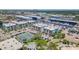 Aerial shot of waterfront condos showcasing tennis courts, lush landscaping, and easy boat access at 4908 38Th S Way # 206, St Petersburg, FL 33711