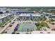 Wide aerial shot displays condos with a tennis court and boat docks in a premier coastal neighborhood at 4908 38Th S Way # 206, St Petersburg, FL 33711