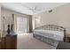 Bright bedroom featuring carpeted floors, ceiling fan, and a large window with pleasant natural light and neutral walls at 4908 38Th S Way # 206, St Petersburg, FL 33711