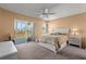 A serene bedroom showcases an open slider to a patio with a cozy bed and coordinated lamps on nightstands at 4908 38Th S Way # 206, St Petersburg, FL 33711
