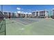 Community tennis court with well maintained landscaping and residential buildings at 4908 38Th S Way # 206, St Petersburg, FL 33711