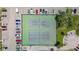 Aerial view of the tennis courts surrounded by parking and trees at 4908 38Th S Way # 206, St Petersburg, FL 33711