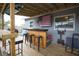 Outdoor deck area with bar, stools, and exercise equipment offering a unique space for relaxation and fitness at 5205 98Th N Ter, Pinellas Park, FL 33782