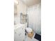 Clean and modern bathroom with white vanity, toilet, striped shower curtain, and a practical step stool at 5205 98Th N Ter, Pinellas Park, FL 33782