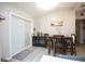 Cozy dining area featuring a modern table setting, sliding glass doors, and stylish decor for intimate meals at 5205 98Th N Ter, Pinellas Park, FL 33782