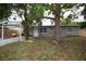 Charming single-story home with a covered carport and well-maintained front yard and mature trees at 5205 98Th N Ter, Pinellas Park, FL 33782