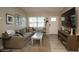 Bright living room featuring a comfortable sofa, large window, and modern decor for a welcoming space at 5205 98Th N Ter, Pinellas Park, FL 33782