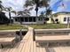 Quaint backyard leading to a private dock and waterway, offering a peaceful retreat with serene waterfront views at 5445 Manatee Point Dr, New Port Richey, FL 34652