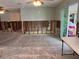 Open-concept living room with sliding glass door, ready for customization at 5445 Manatee Point Dr, New Port Richey, FL 34652