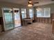 Open-concept living room with sliding glass door to waterfront at 5445 Manatee Point Dr, New Port Richey, FL 34652