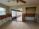 Bright and airy living room with natural light and doorway to the patio at 5445 Manatee Point Dr, New Port Richey, FL 34652