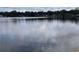 A calm waterfront view invites peaceful reflection, highlighting the property's tranquil setting and natural beauty at 5445 Manatee Point Dr, New Port Richey, FL 34652