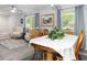 Dining area adjacent to living room with natural light at 606 Brentwood Pl, Brandon, FL 33511